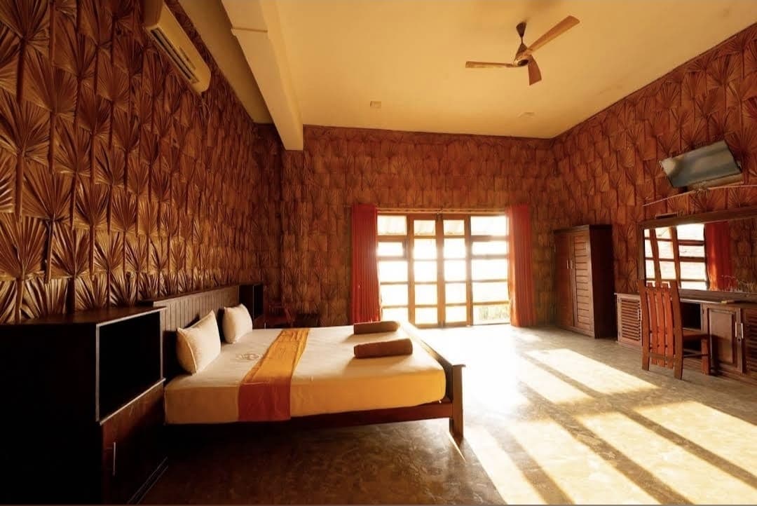 Open-air restaurant with bamboo columns and brick walls
