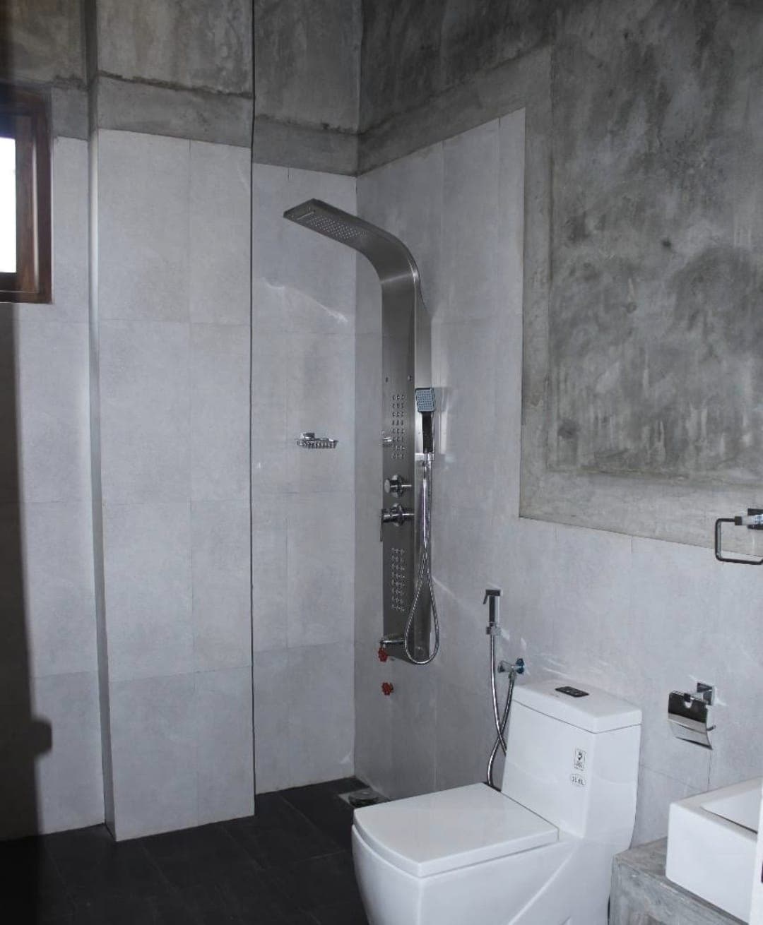 Hotel exterior at sunset with ocean backdrop